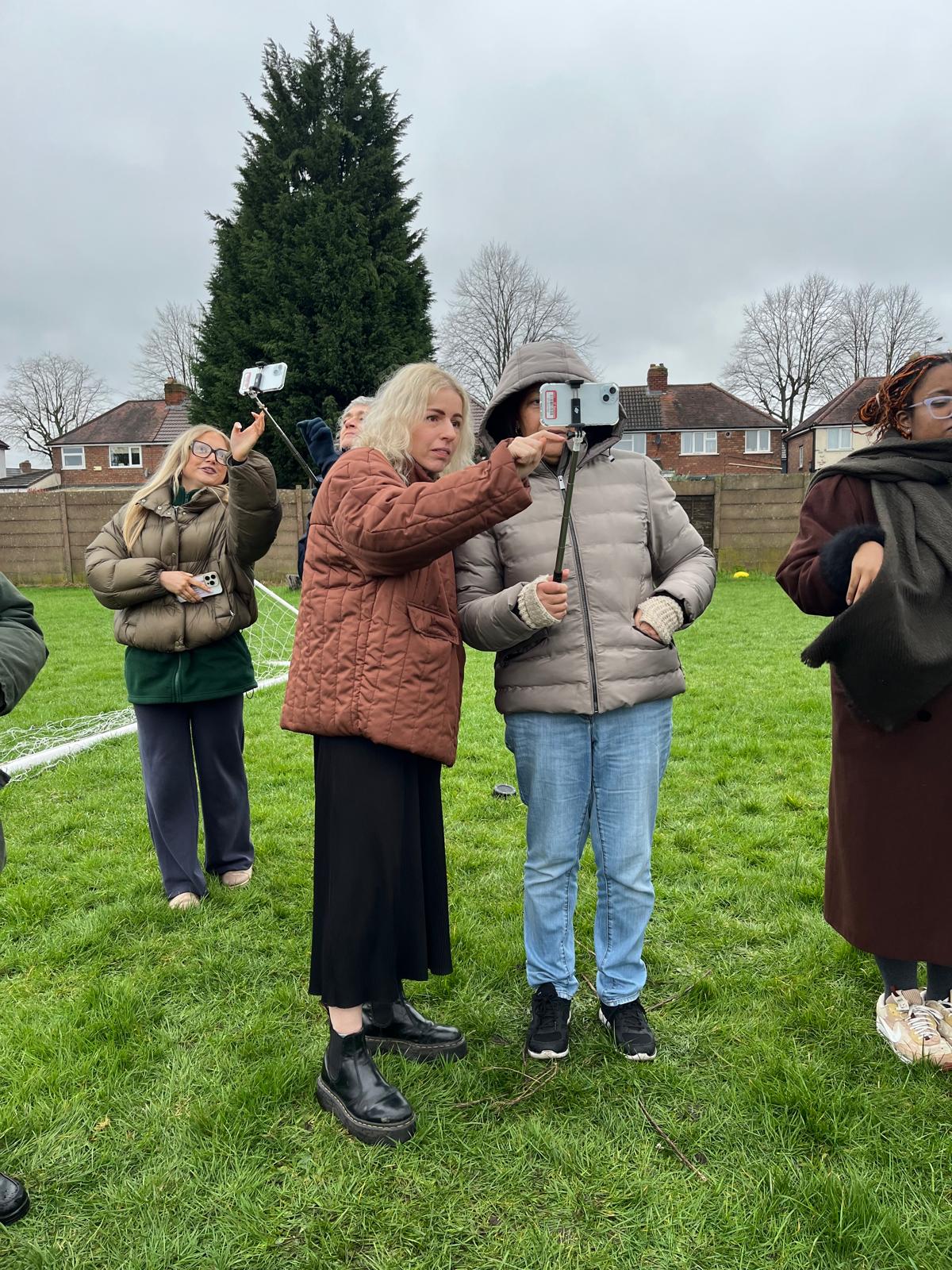 Brimigham particpants looking through phones